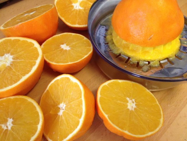 Oranges being juiced