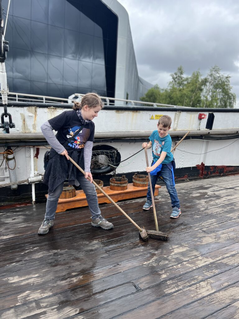 Tall Ship Glenlee scrubbing the deck