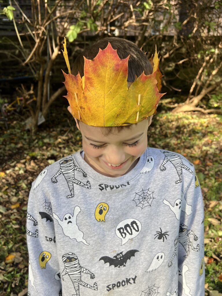 Boy wearing an Autumn leaf crown