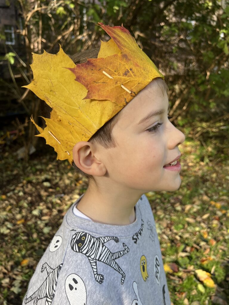 Boy wearing an Autumn leaf crown