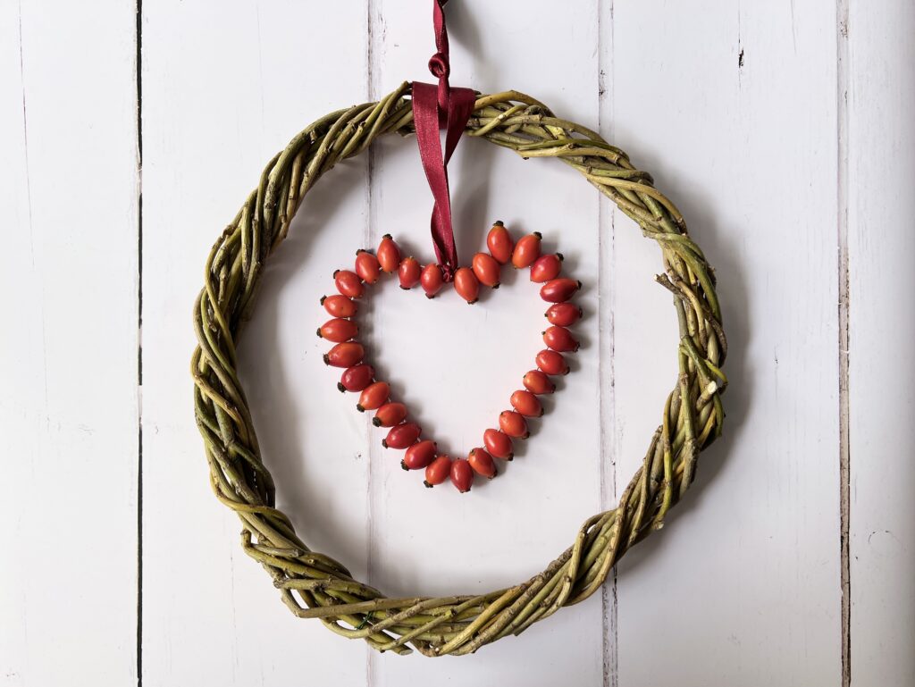 hand woven willow wreath with rose hip heart